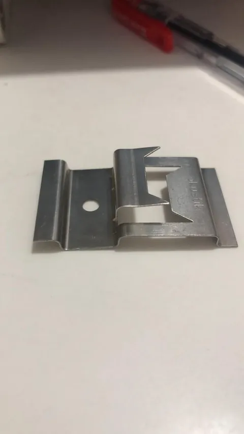Precision stamped metal component made by Ruby Infra